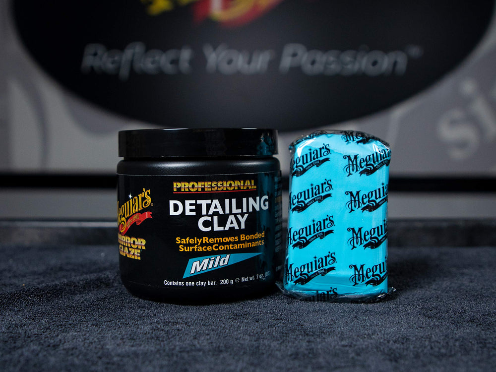 Spraying Meguiar's lubricant with clay in use to protect paint and prevent marring