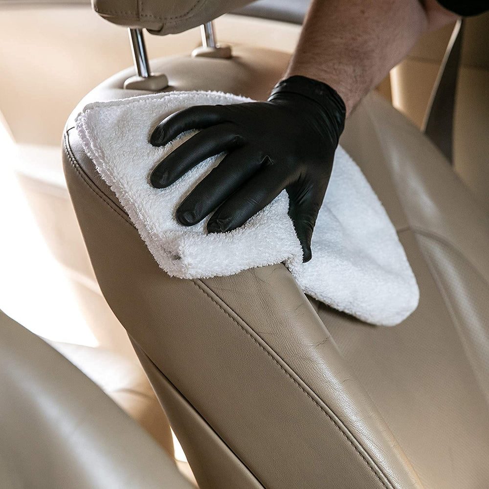 Meguiar's D18001 gallon beside a hand to show scale and professional supply advantage