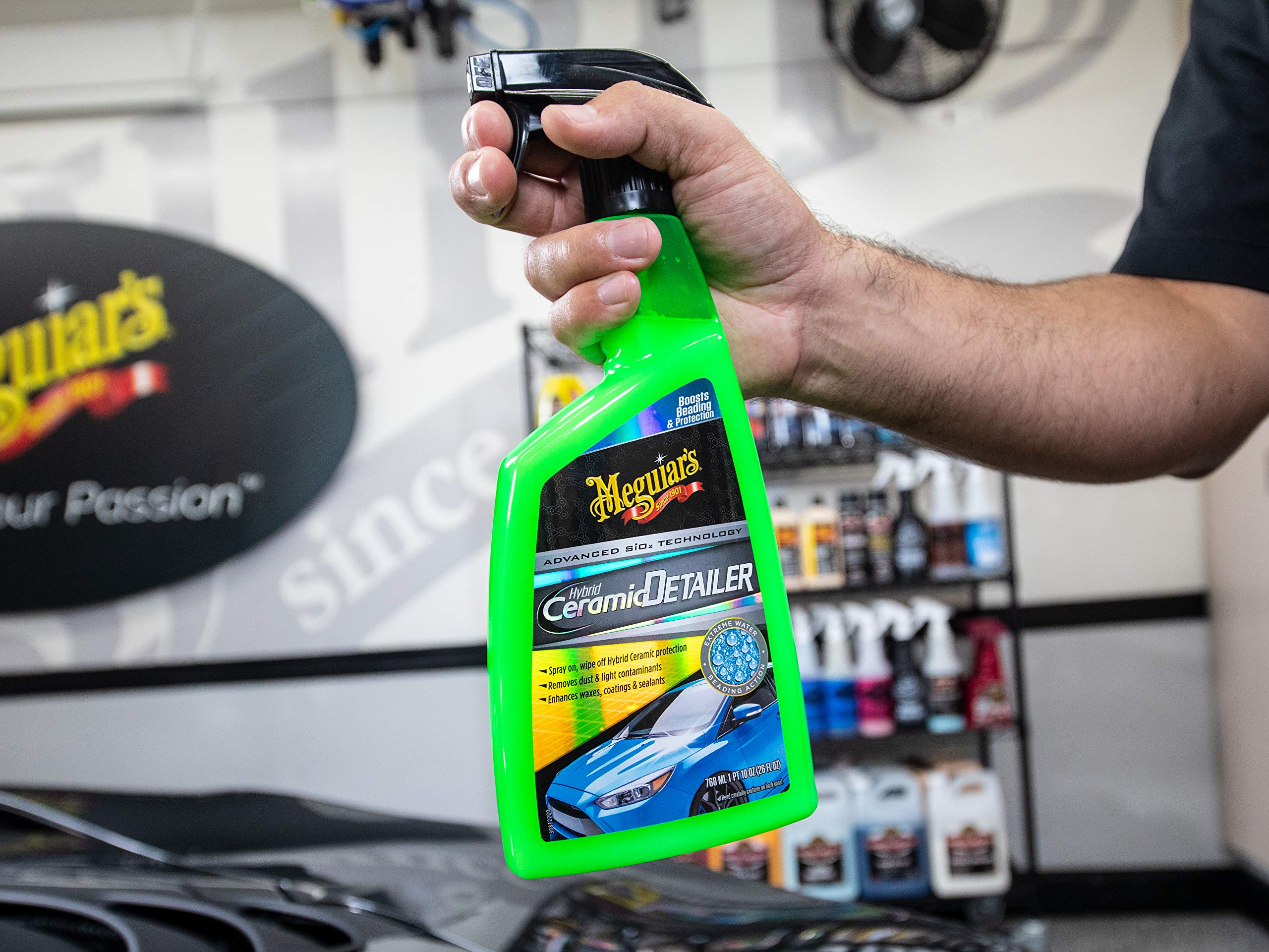 Meguiar's product on black paint showing enhanced gloss and clarity