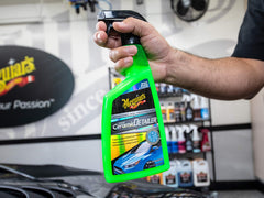 Meguiar's product on black paint showing enhanced gloss and clarity