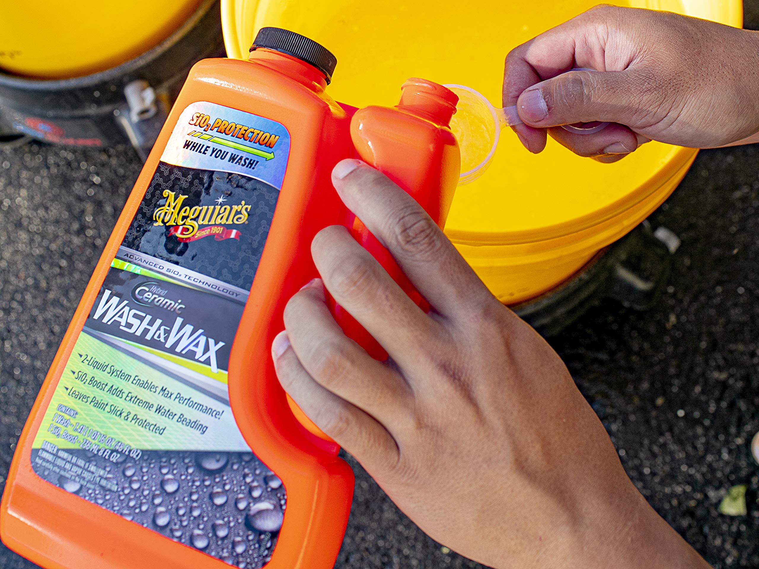Meguiar's bottles shown with hand for scale and application clarity