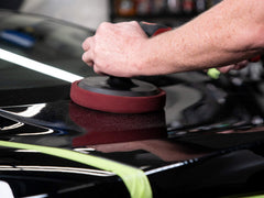 Meguiar's before and after car paint panel showing reduced swirls and improved gloss