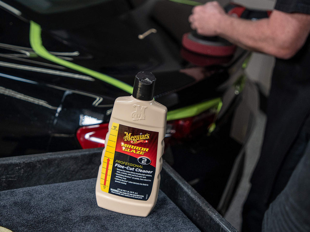 Meguiar's compound texture on applicator pad showing cutting-to-rouge action benefit