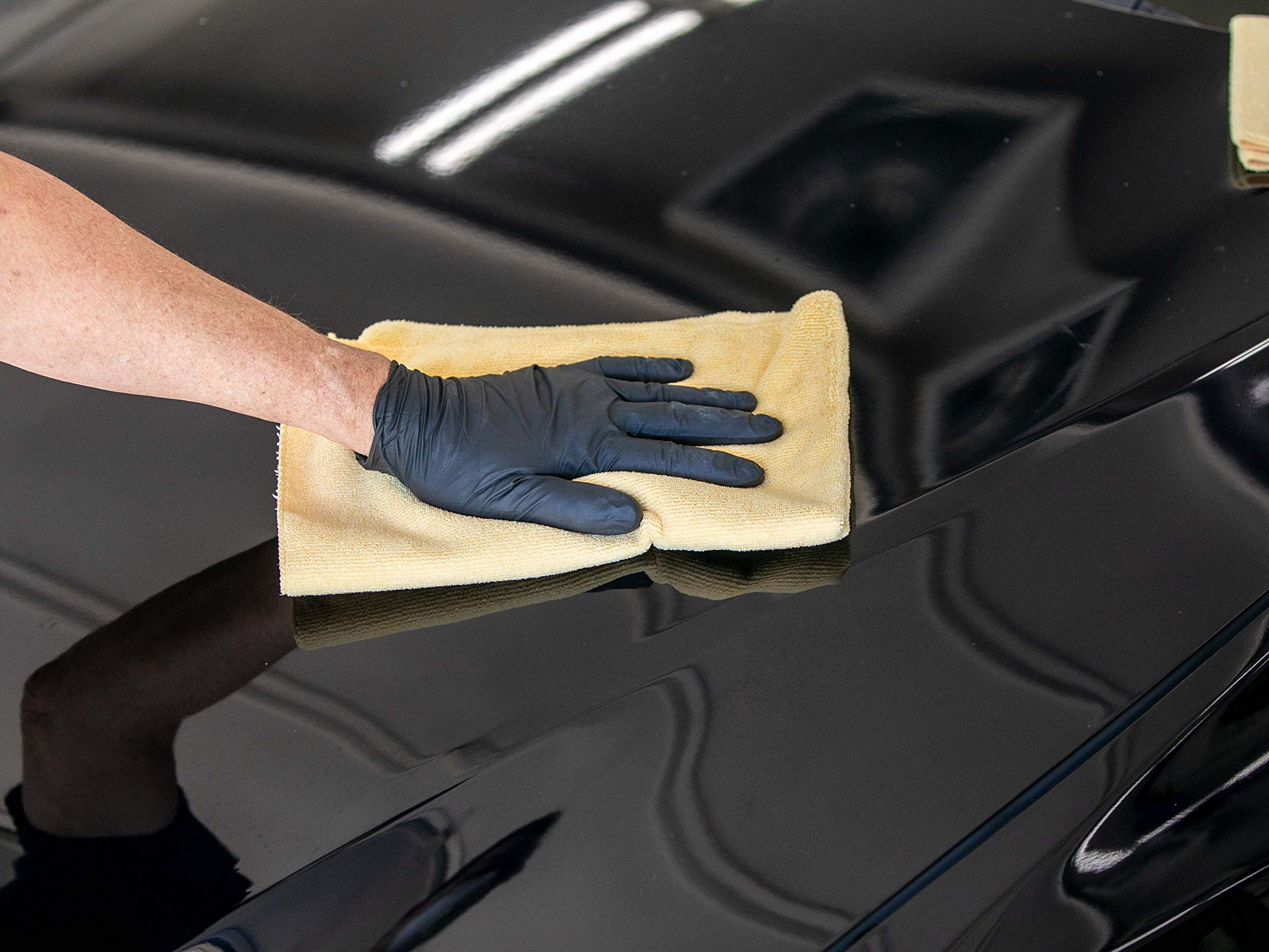 Meguiar's gallon next to smaller bottles showing cost-efficient shop sizing benefit