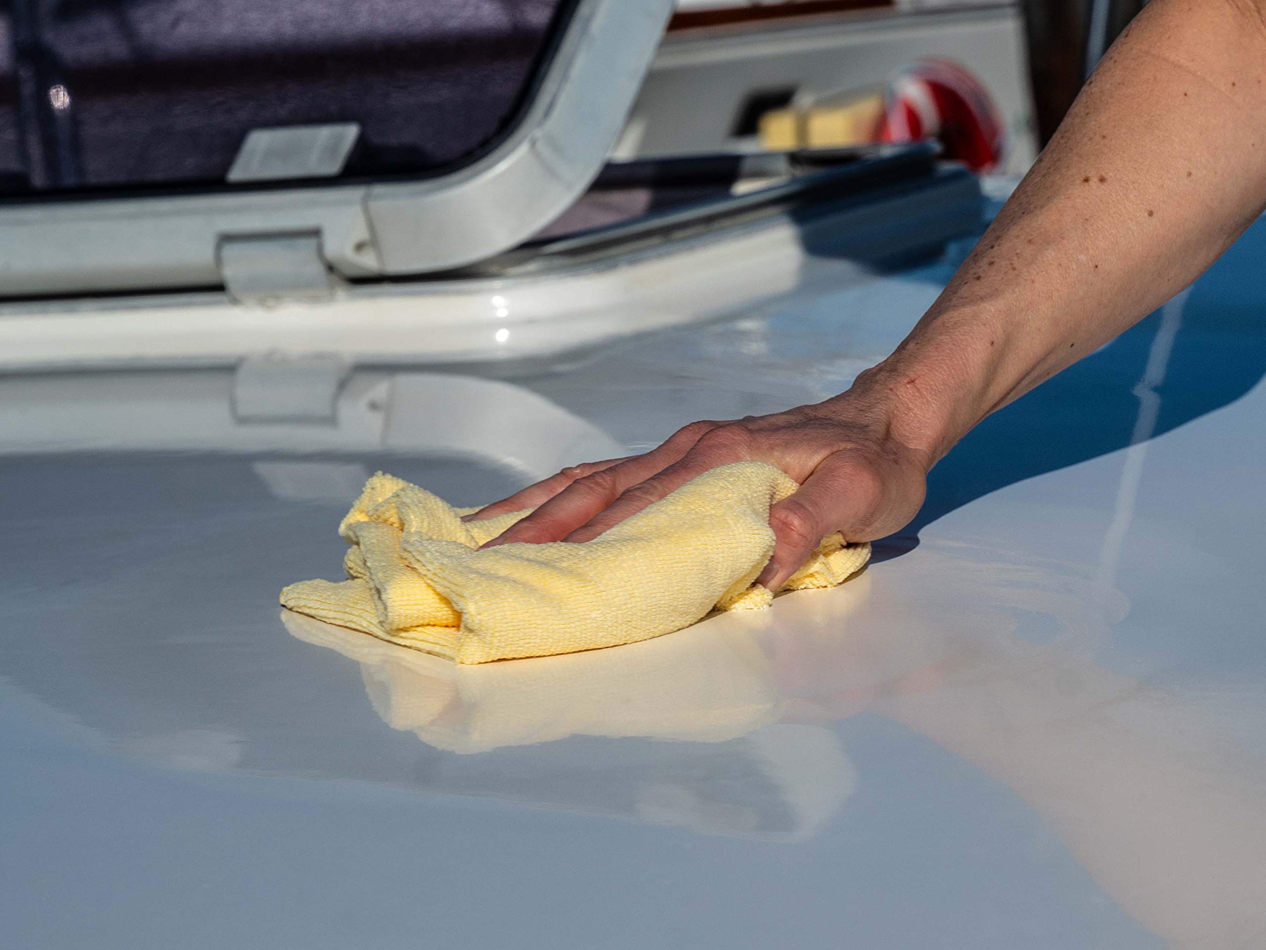 Meguiar's M91 bottle beside hybrid ceramic sealant showing recommended post-seal benefit