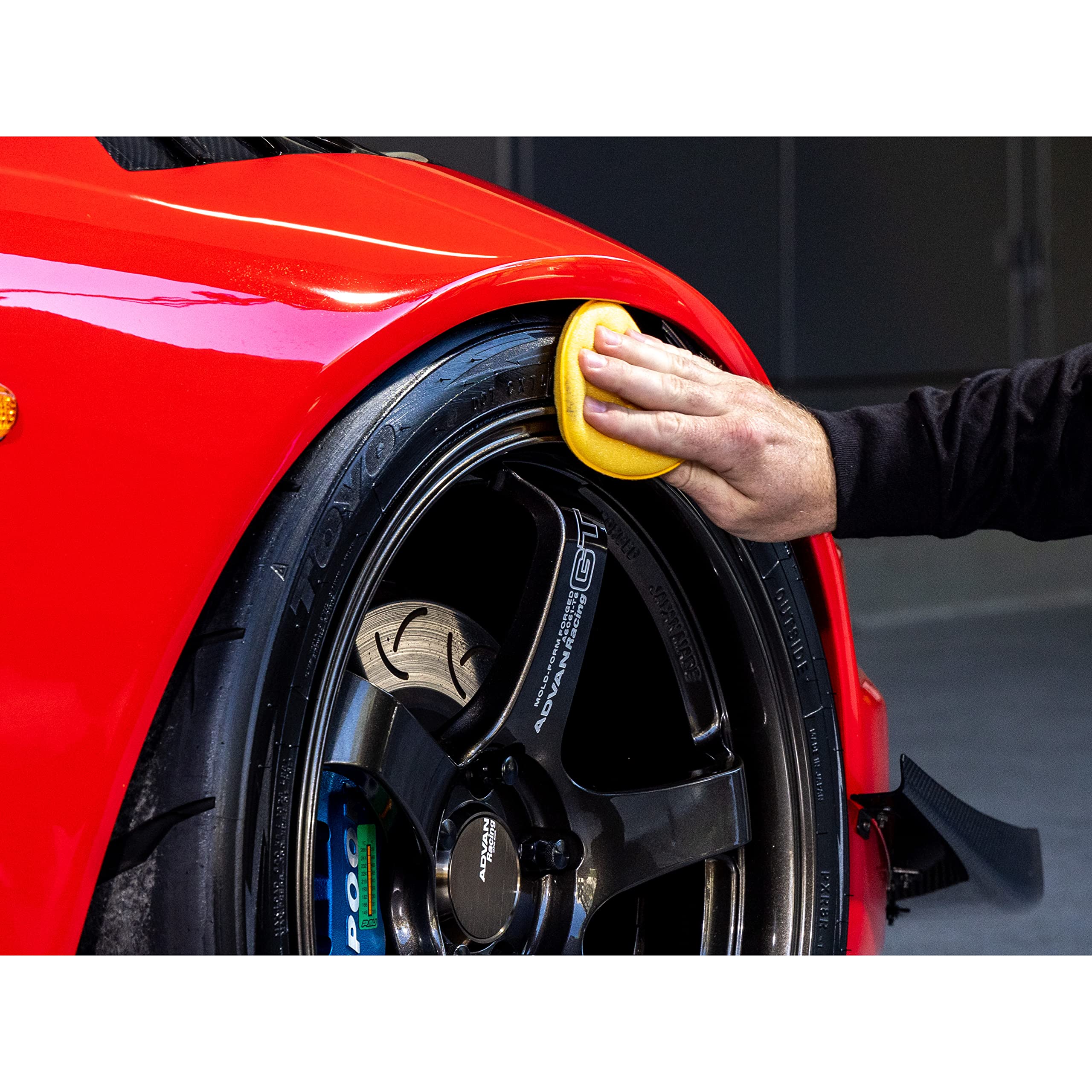Meguiar's hand holding bottle showing 16 oz scale and portability