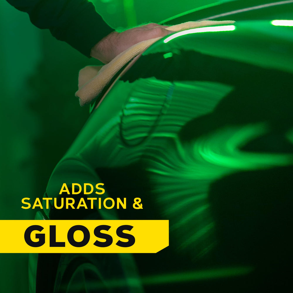 Meguiar's wipe-off cloth removing residue to reveal mirror finish benefit