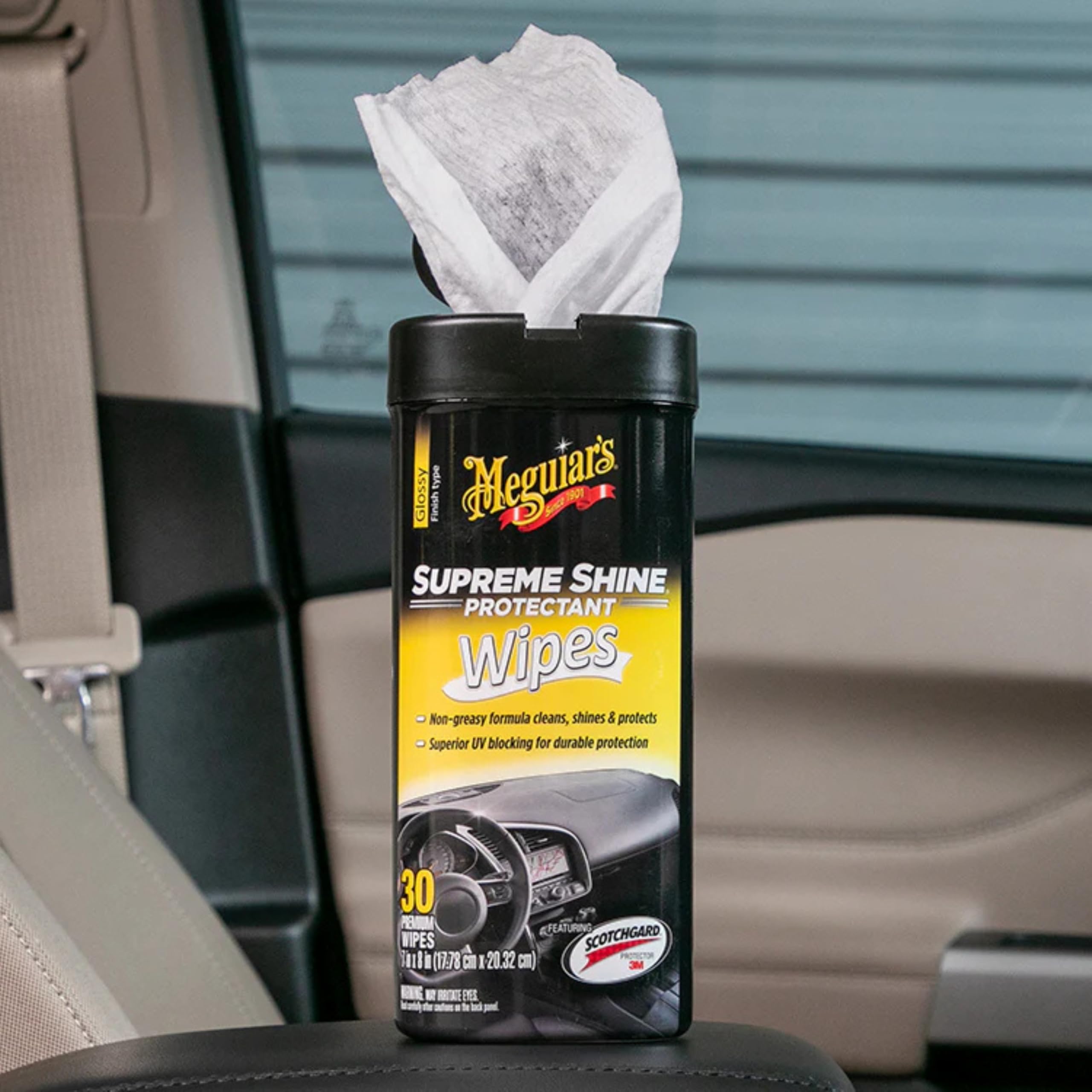 Meguiar's wipe being used on dashboard showing improved shine and protected finish benefit