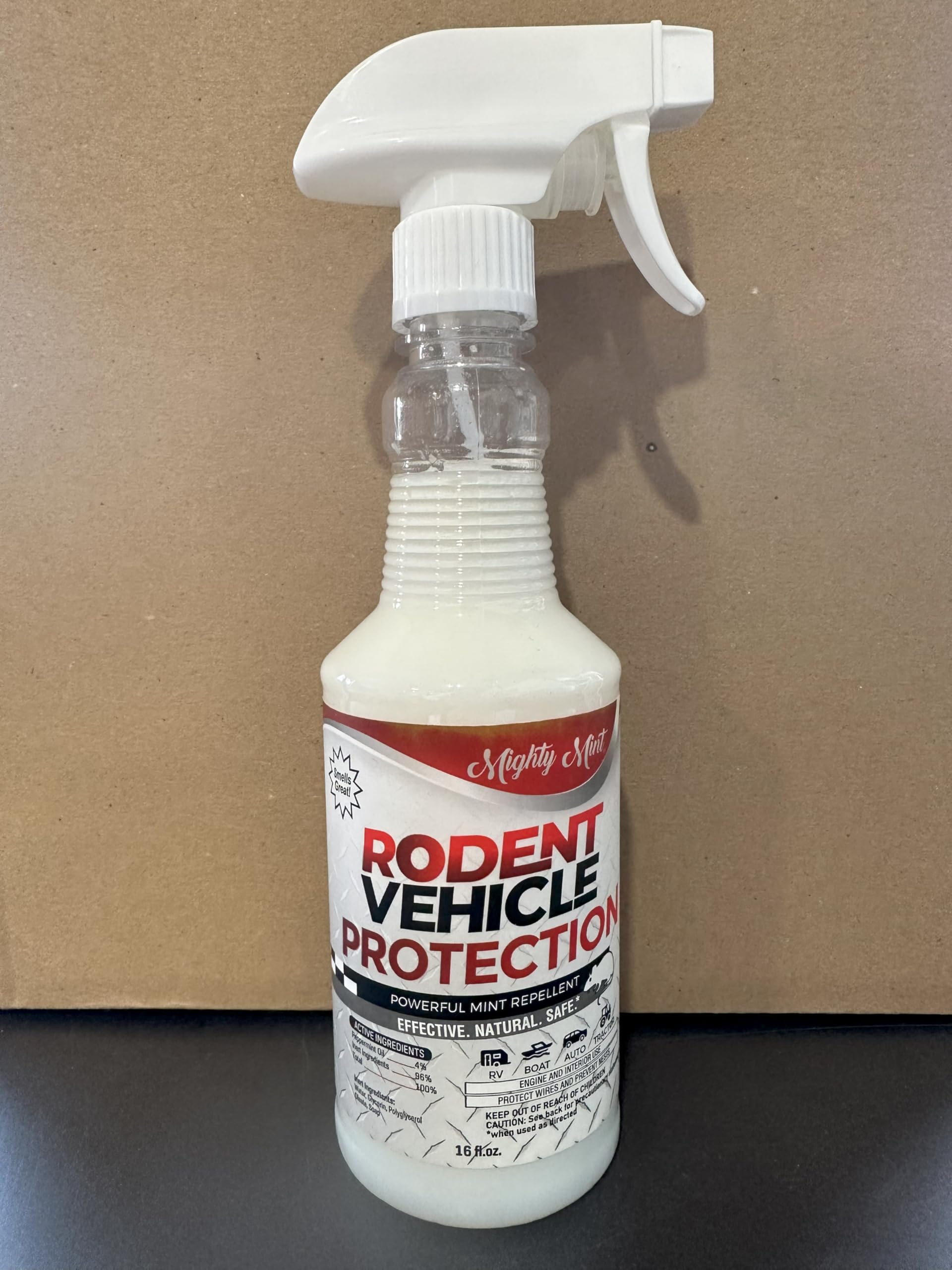 Mighty Mint bottle held in hand to show 16 oz scale and convenient size