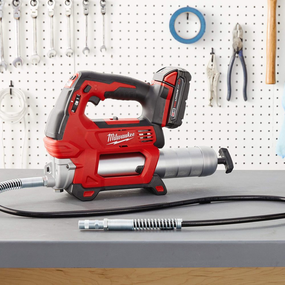 milwaukee grease gun in service scene with technician, speeds maintenance tasks