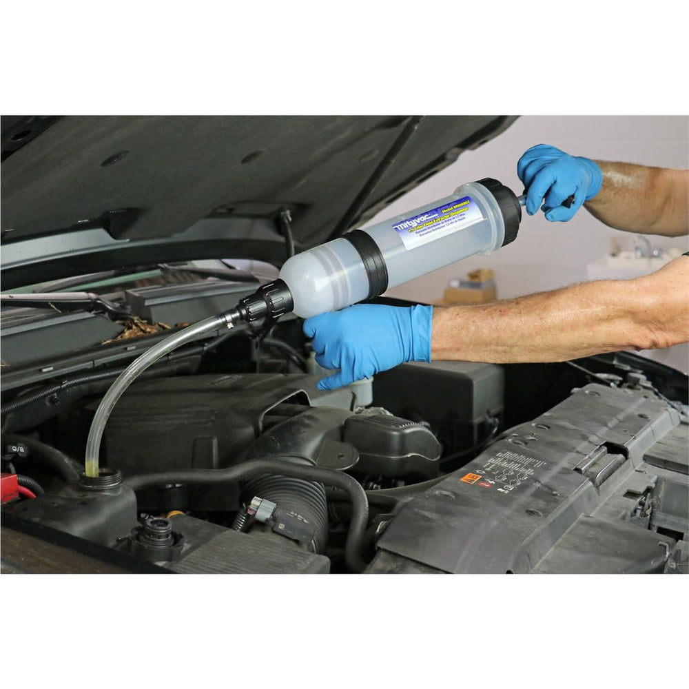 Mityvac in‑use extracting fluid from a master cylinder showing safe, controlled service