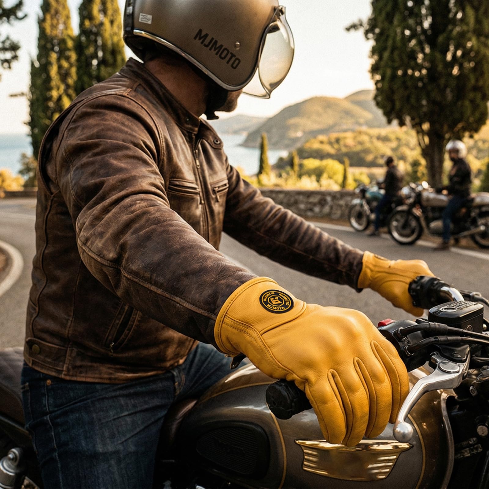 mjmoto gloves worn by rider on bike demonstrating real-world use benefit