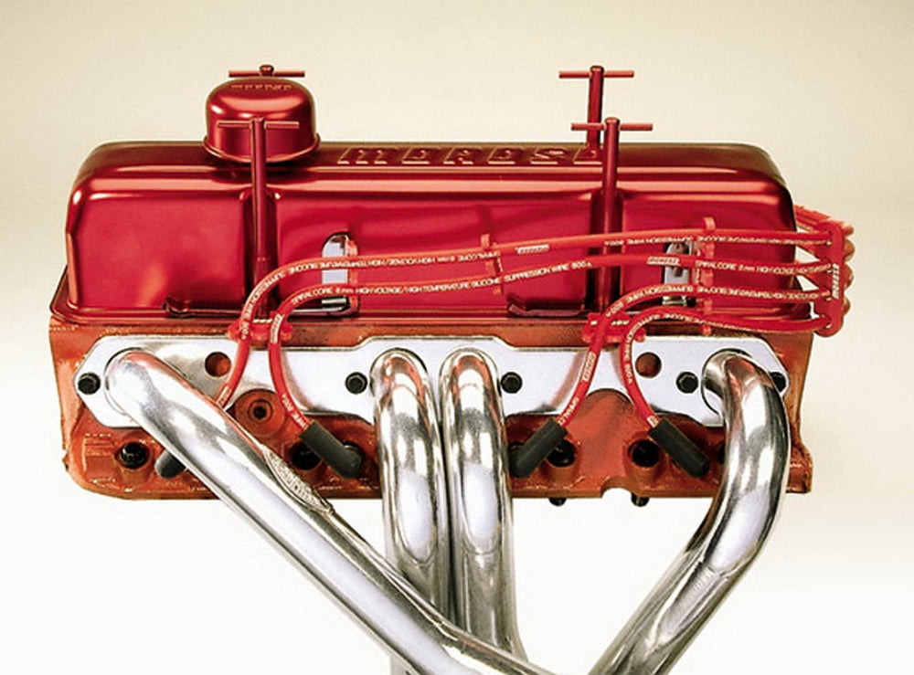 Moroso chrome bracket and black loom close-up showing secure valve-cover mounting