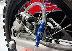 Motion Pro 08-0143 installed on caliper demonstrating secure seal and cleaner bleeding