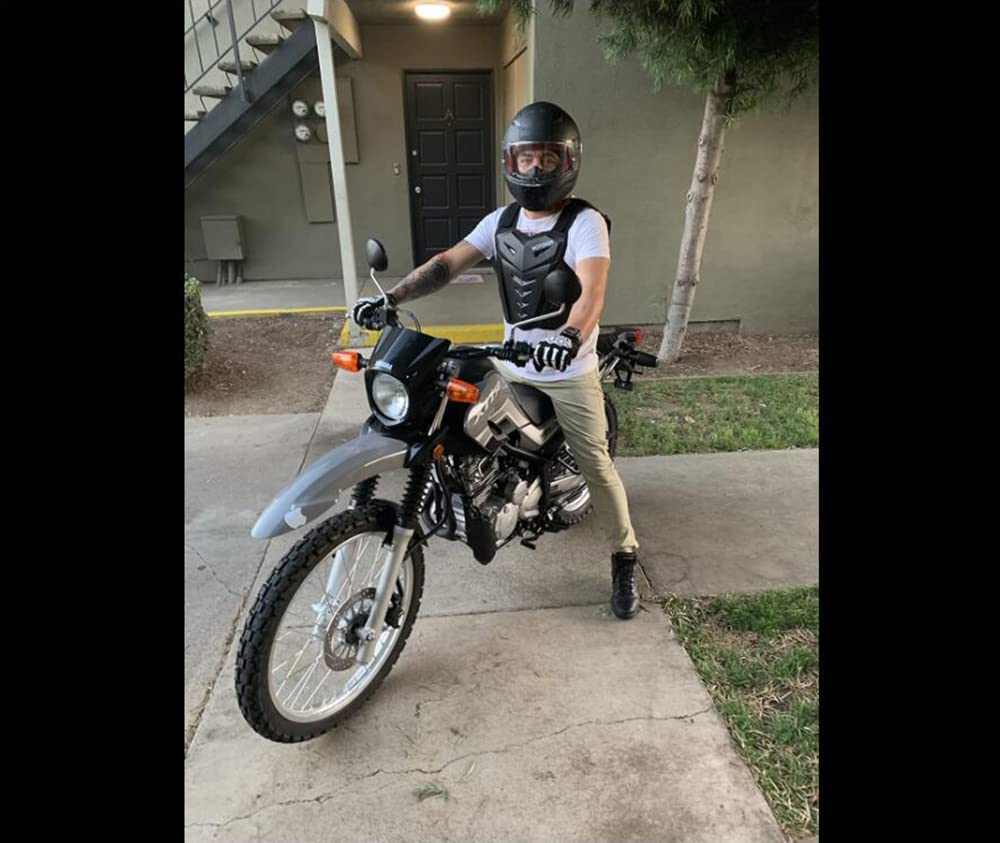 MOTOKER worn by rider demonstrating range of motion and on-track protection