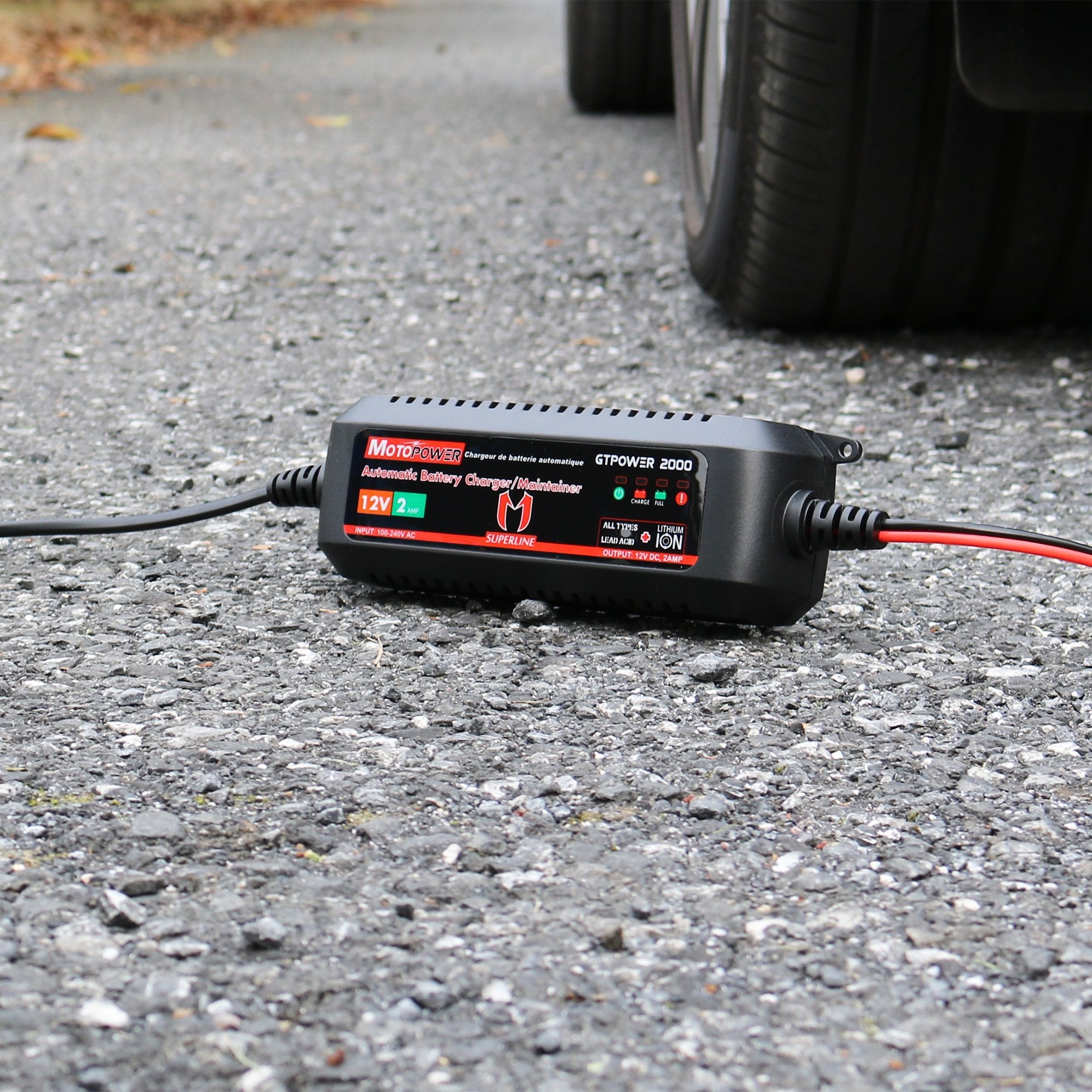 MOTOPOWER beside a hand for size and scale showing compact portability advantage
