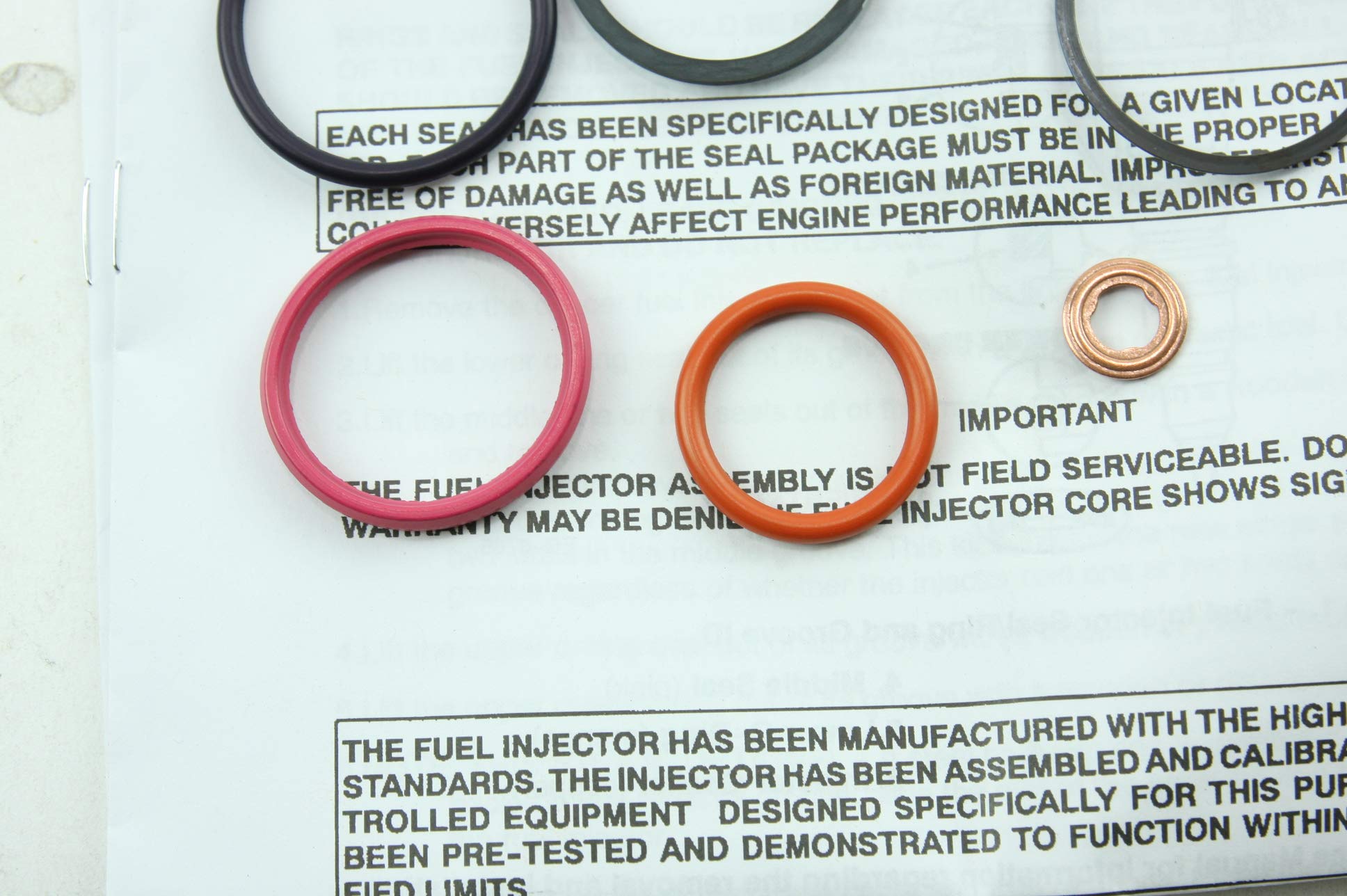 Motorcraft O-ring next to a coin for scale showing precise sizing advantage