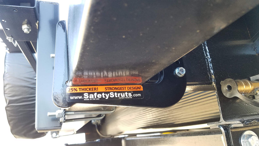 Mount-n-Lock on RV rear in travel setting demonstrating reinforced bumper for hauling gear benefit