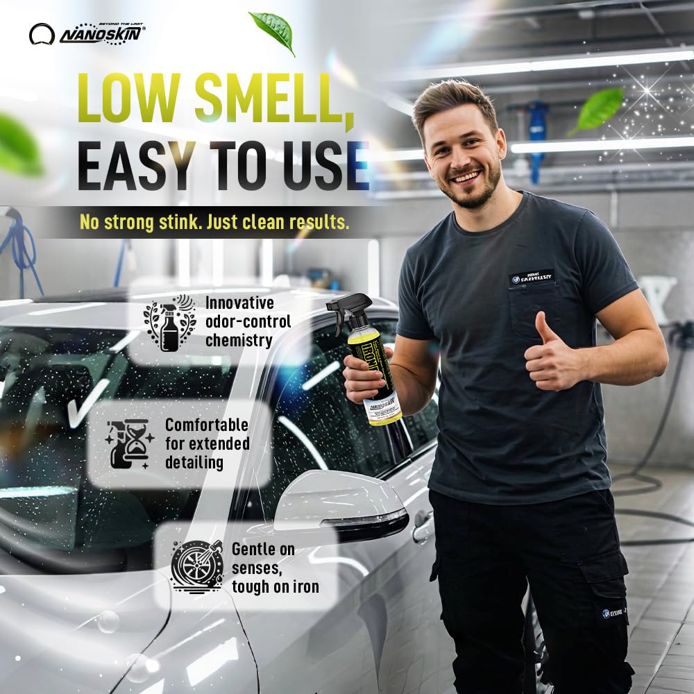 Nanoskin IRON FREE on car paint being rinsed off, illustrating safe decontamination before waxing