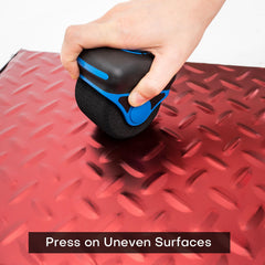 NEWISHTOOL roller smoothing vinyl on a car door to ensure seamless adhesion on curves