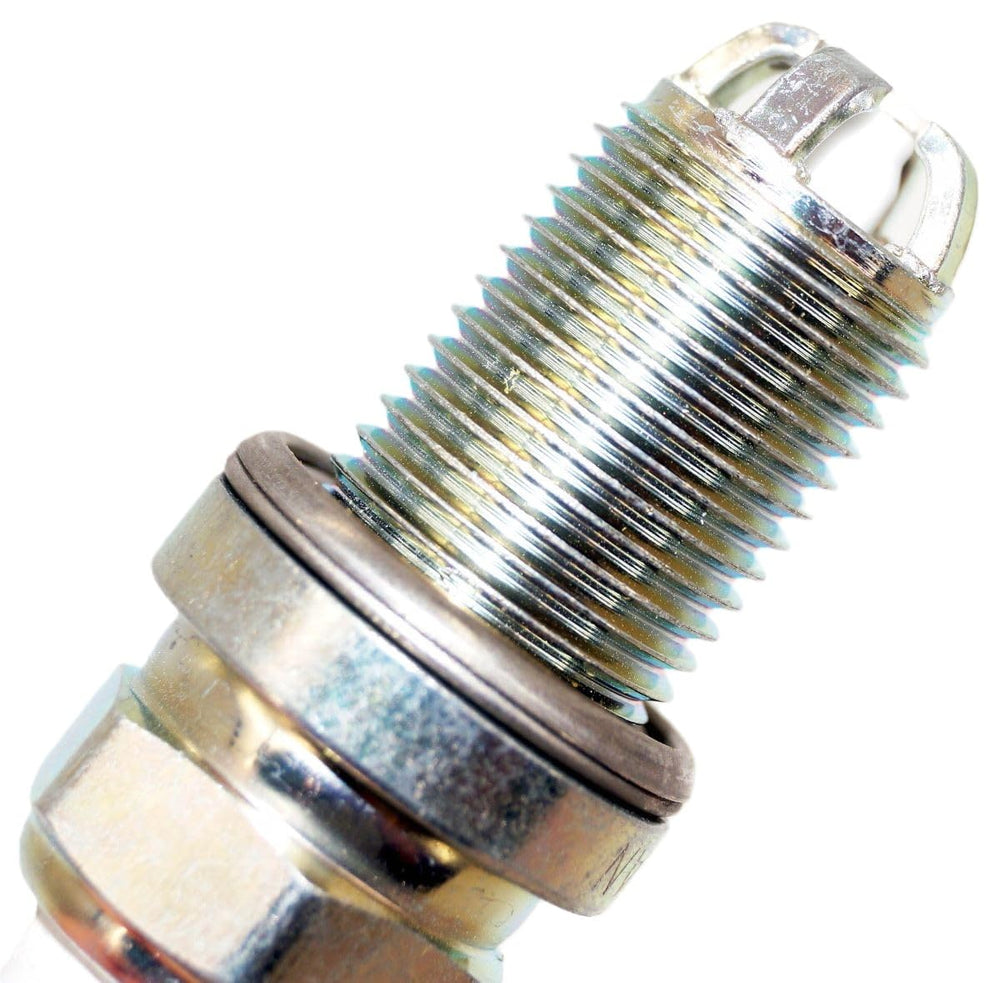 NGK 3199 next to ruler showing 19mm reach for exact OEM fitment