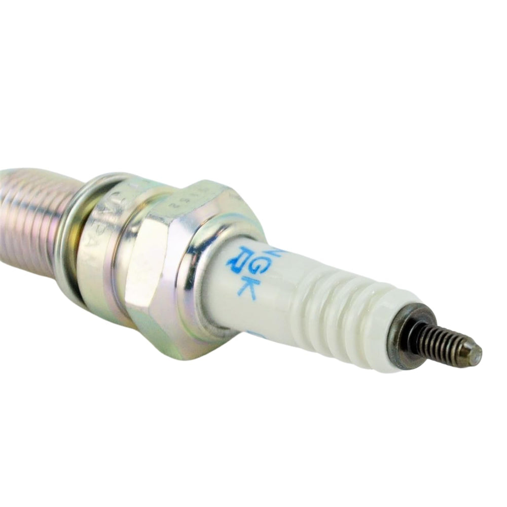 NGK spark plug installed in cylinder head demonstrating proper fit and consistent ignition