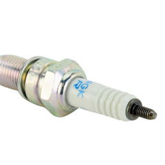 NGK spark plug installed in cylinder head demonstrating proper fit and consistent ignition