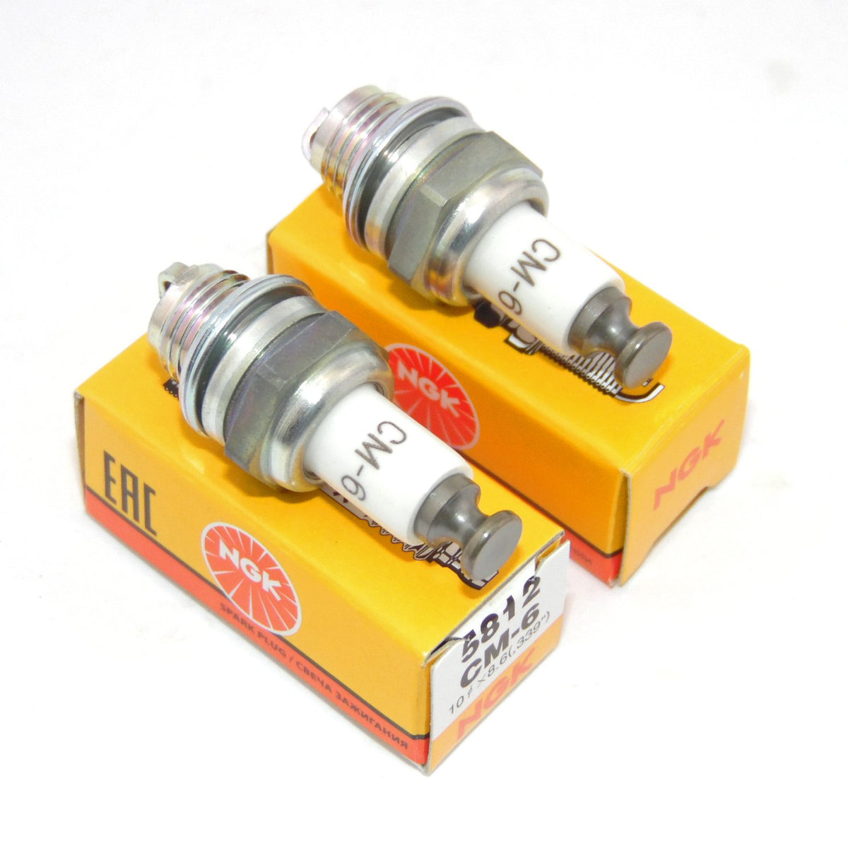 NGK spark plug pair front view showing clean electrodes and reliable fitment
