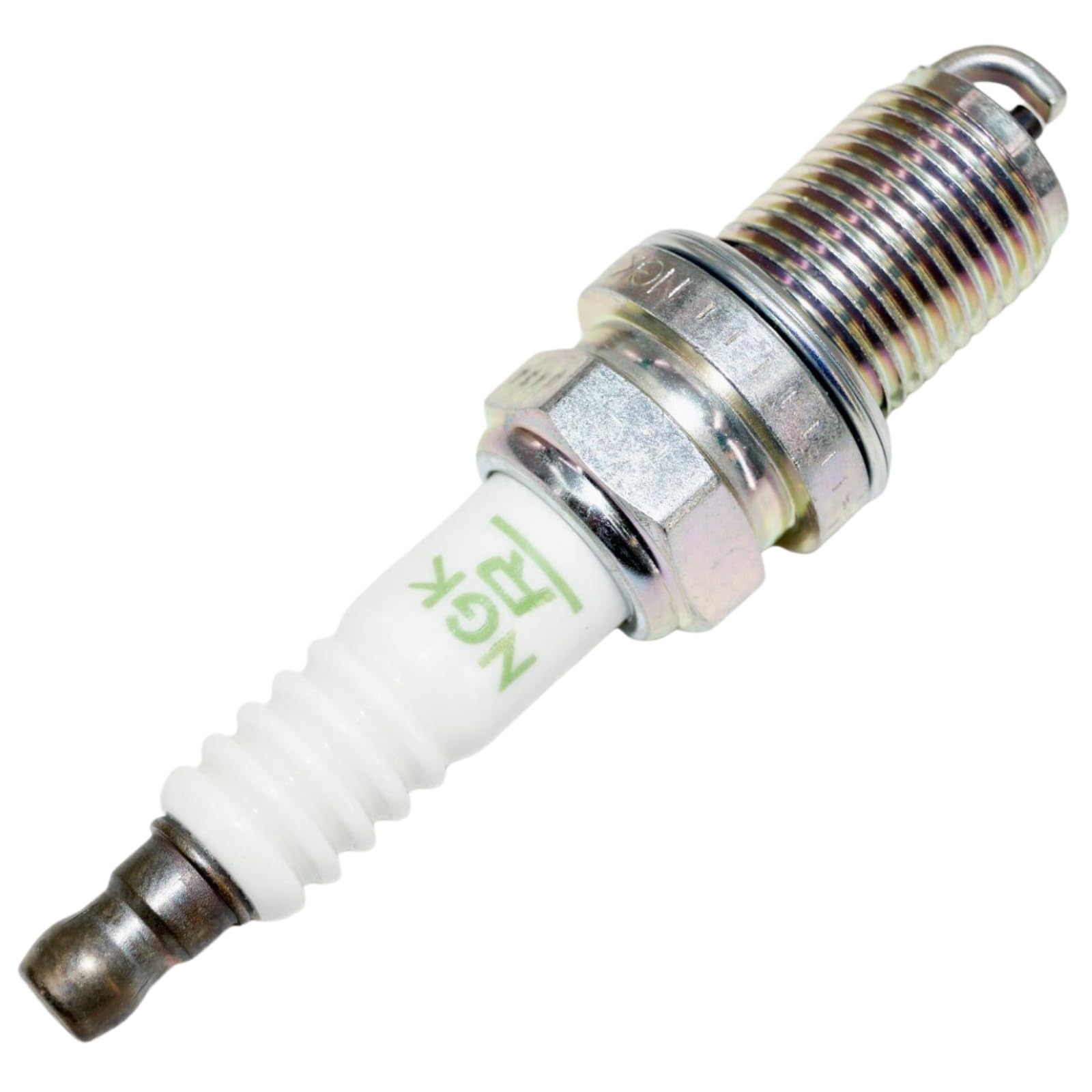NGK spark plug installed in engine port illustrating proper fit and ignition benefit