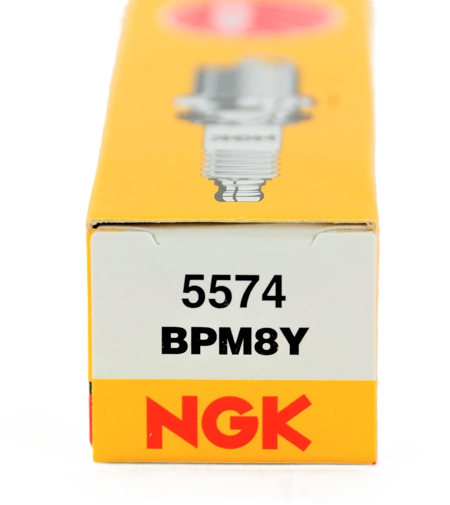 NGK BPM8Y on workbench with tools conveying reliable, workshop-ready parts