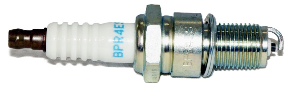 NGK plug insulator with corrugated ribs preventing flashover for dependability