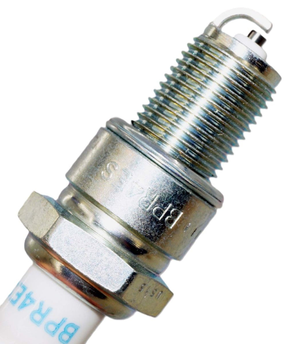 NGK spark plug beside ruler to show size and correct fitment verification