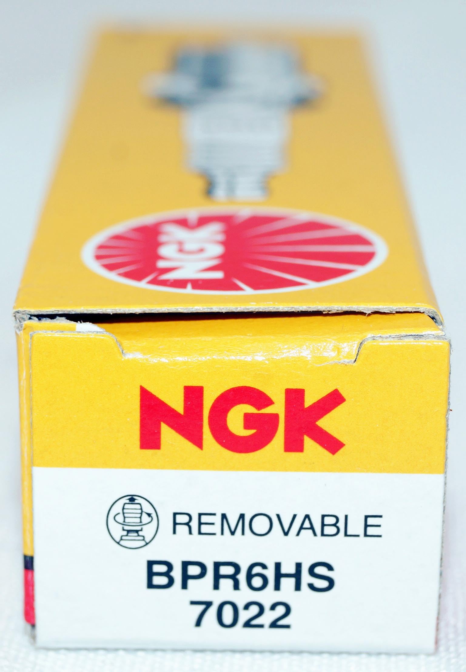 NGK BPR6HS installed in spark plug well illustrating correct fitment benefit