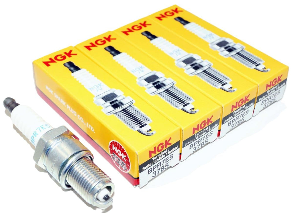 Four NGK BPR7ES plugs arranged, illustrates complete box-of-four replacement convenience