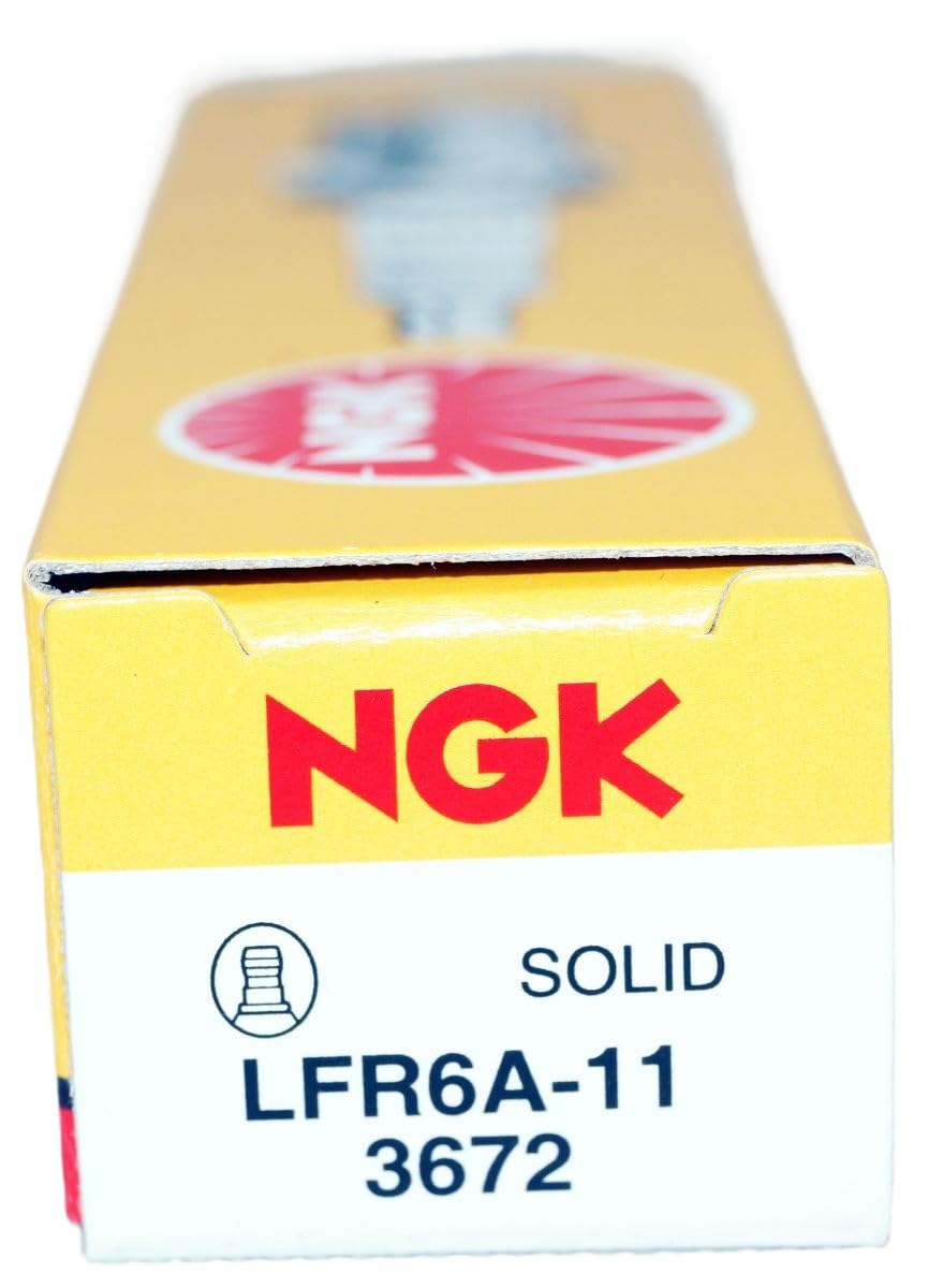 Eight NGK plugs arranged showing complete set for full-bank replacement