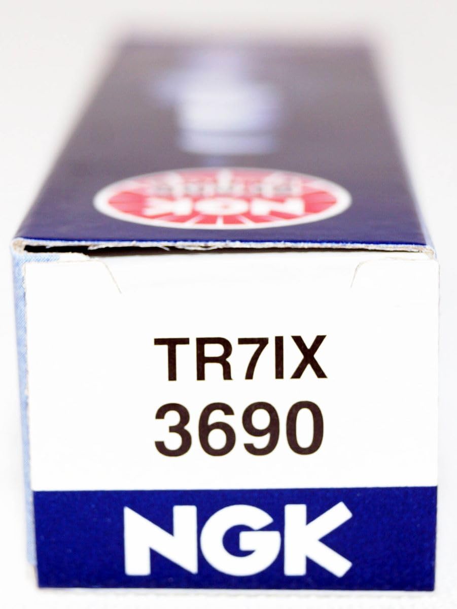 NGK TR7IX plug in hand for scale demonstrating compact size and fitment clarity
