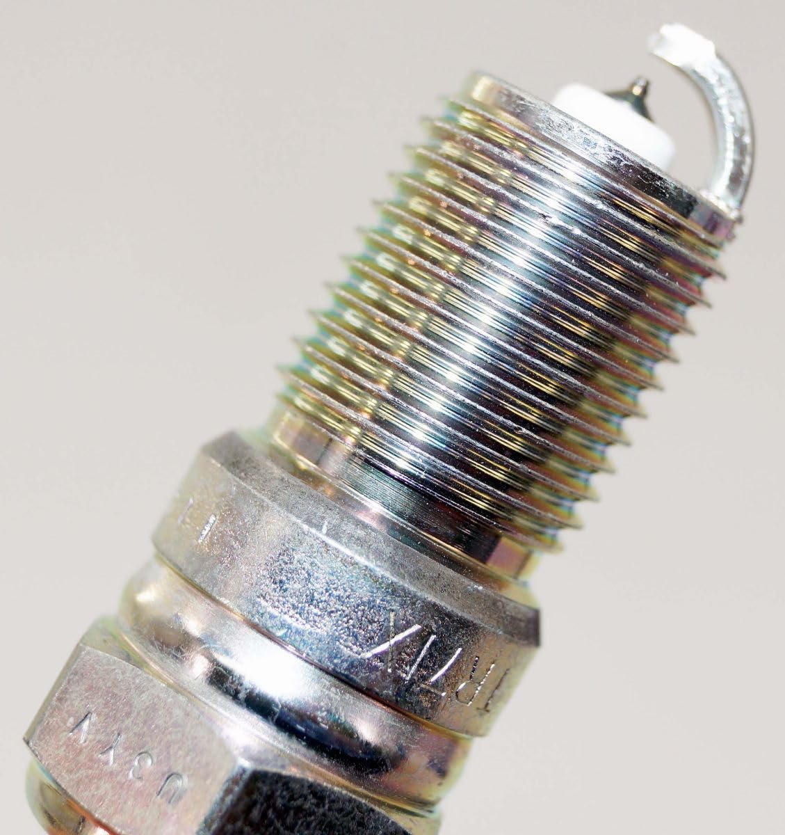 NGK Iridium IX plug installed in an engine bay for reliable ignition performance