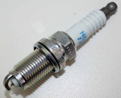 NGK spark plug set on bench with tools showing easy installation benefit