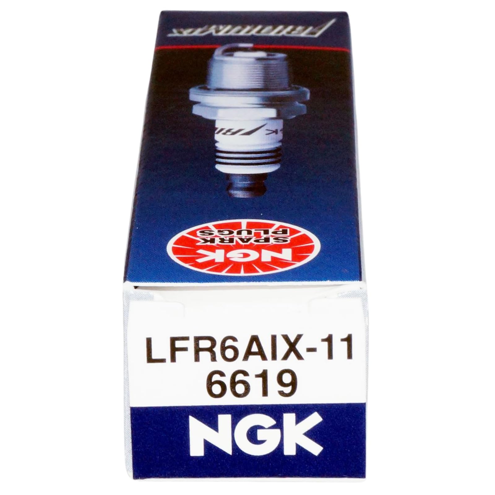 NGK plug next to ruler scale comparison showing compact size and precise manufacturing fit