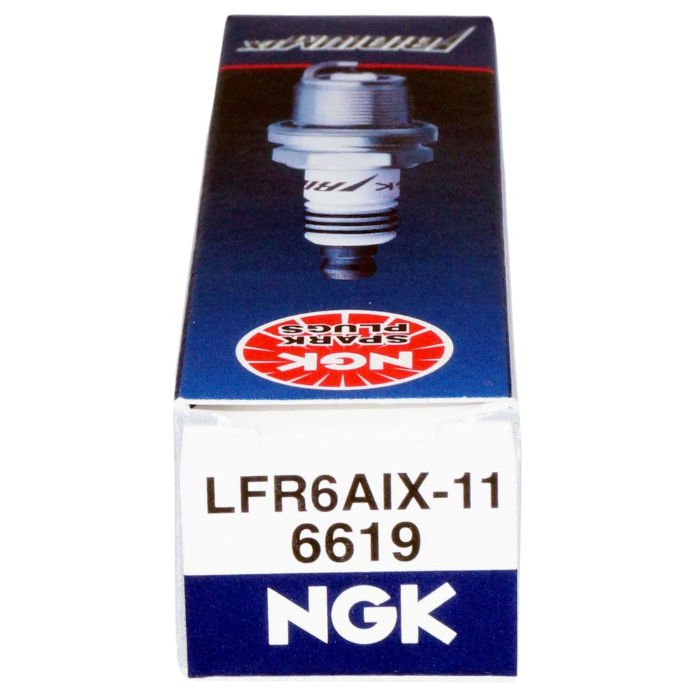 NGK plug next to ruler scale comparison showing compact size and precise manufacturing fit