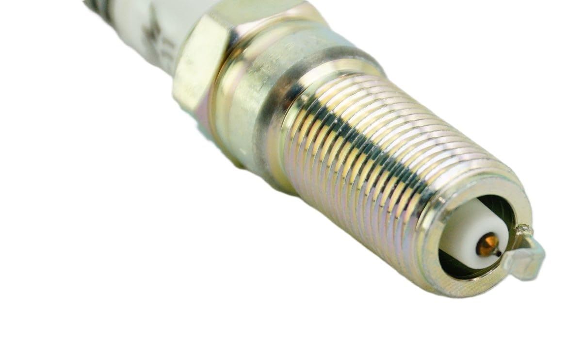 NGK eight spark plugs laid out indicating matched set consistency