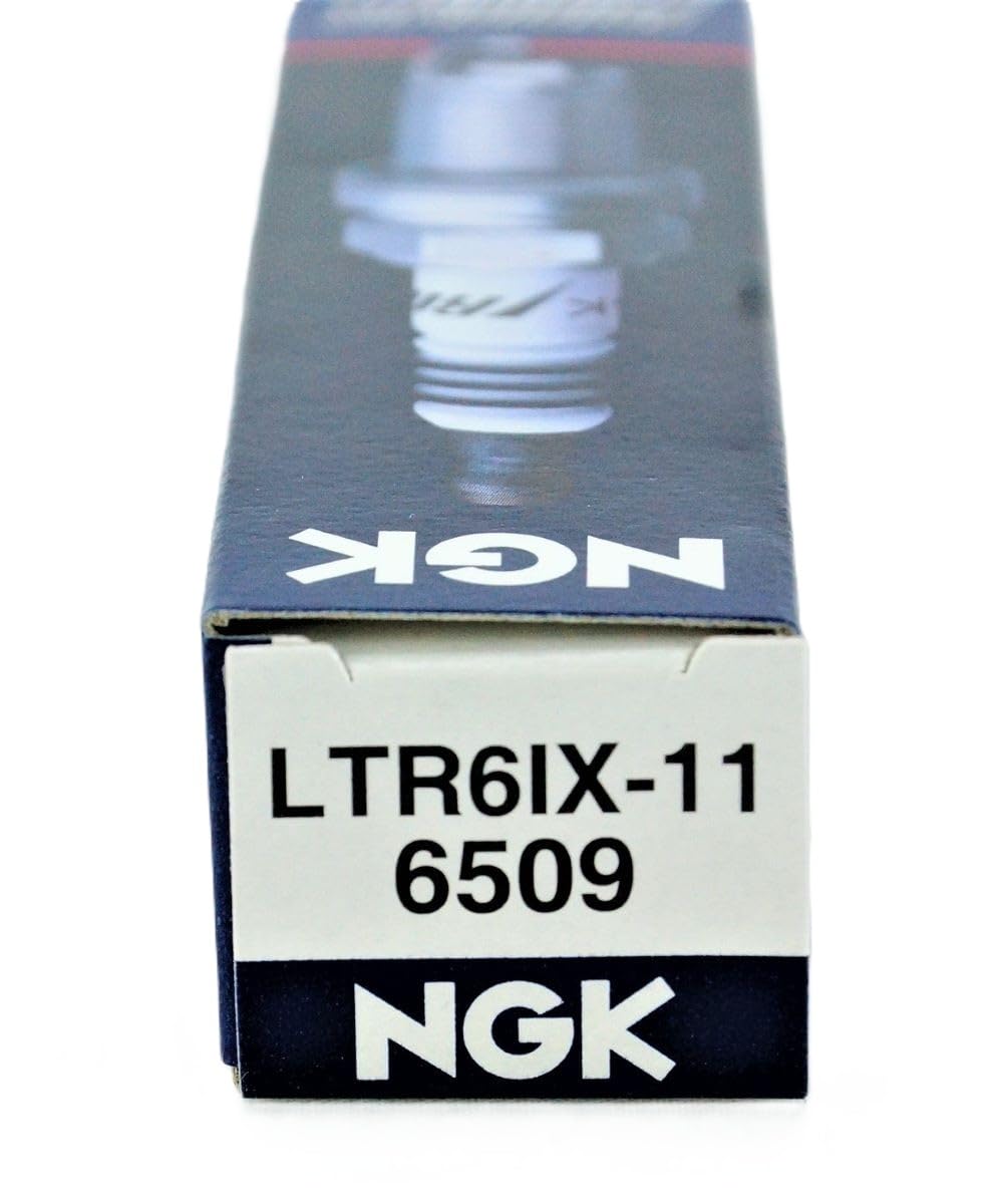 NGK plugs on workshop bench illustrating quick garage installation