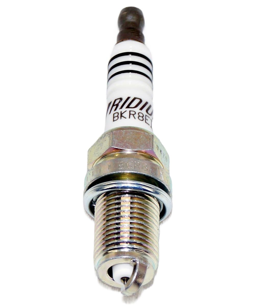 NGK plug next to ruler showing reach measurement for proper engine compatibility