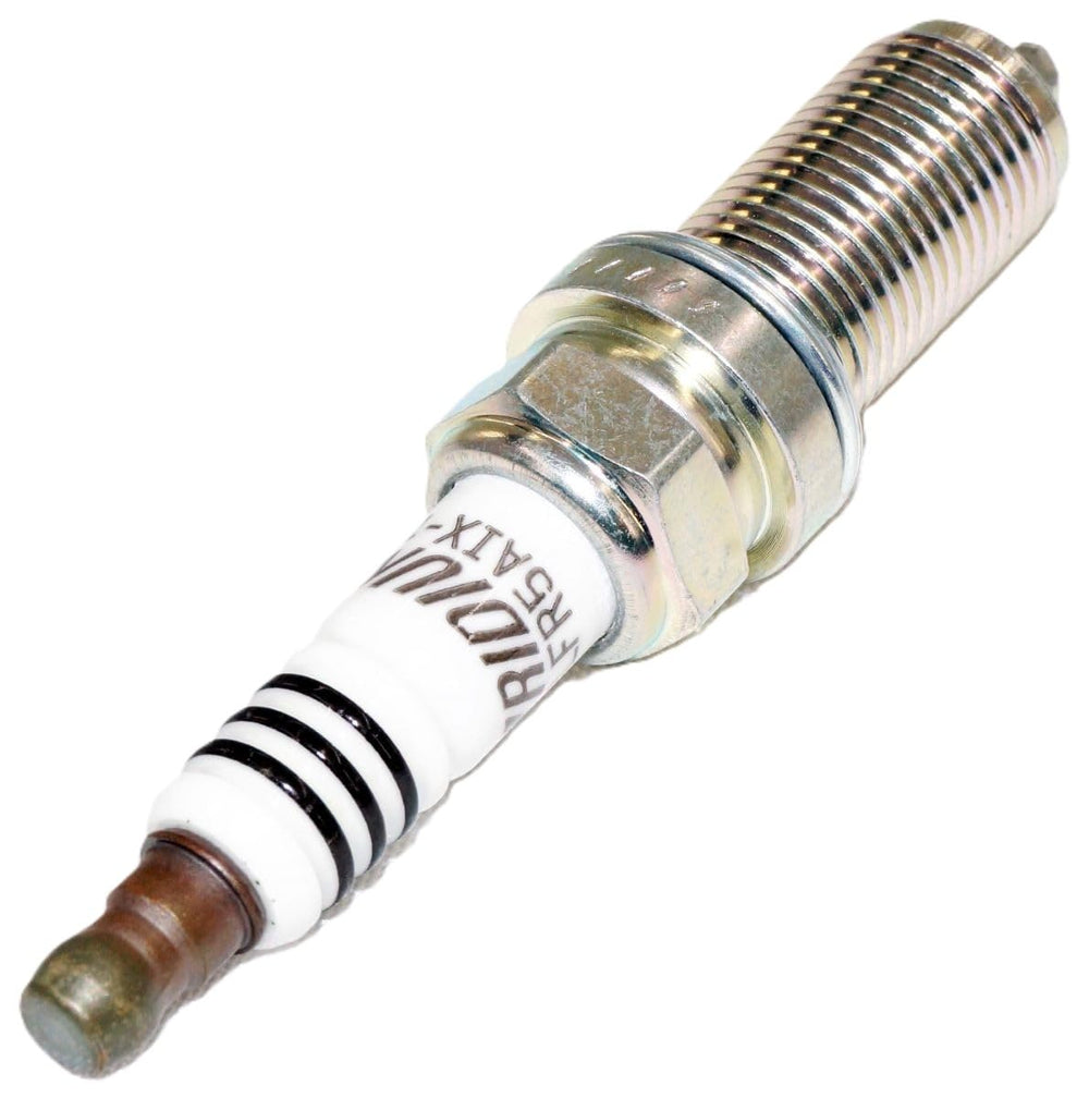 NGK spark plug installed in engine bay demonstrating reliable ignition performance