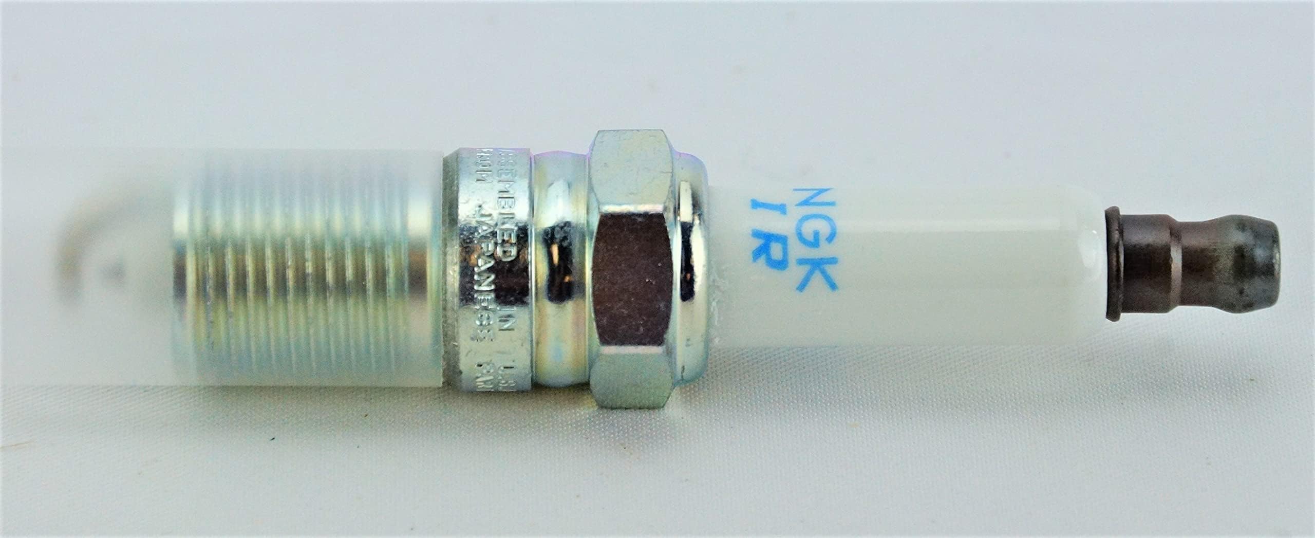 NGK spark plug installed in engine demonstrating reliable combustion performance