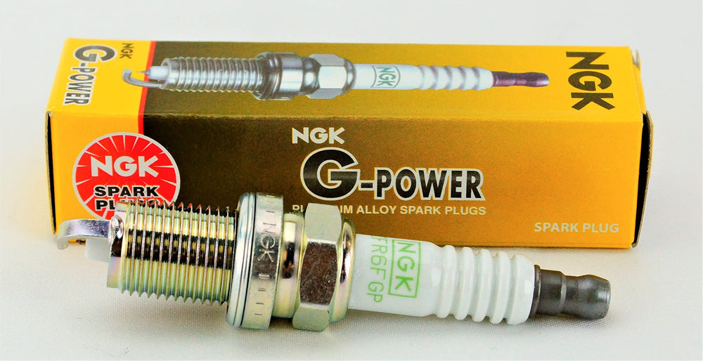 NGK spark plug close-up showing top electrode detail for reliable spark