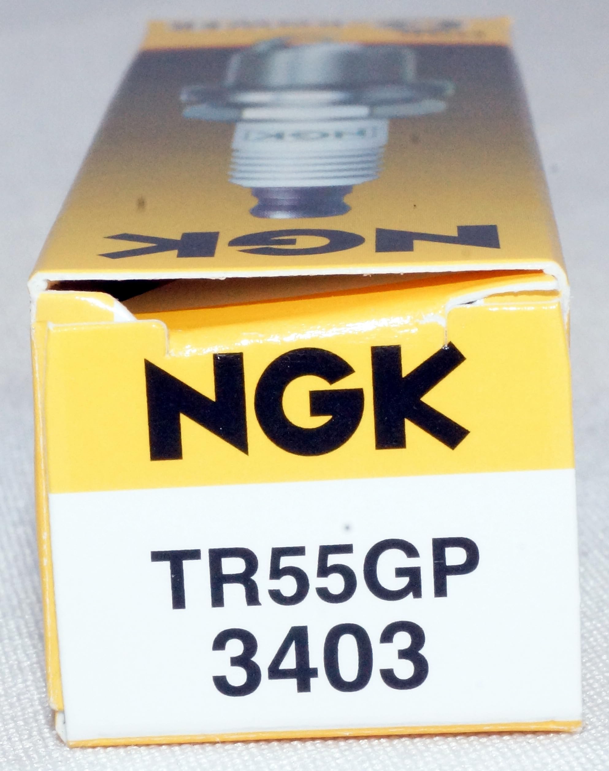 NGK TR55GP installed in engine cylinder showing proper fit and function