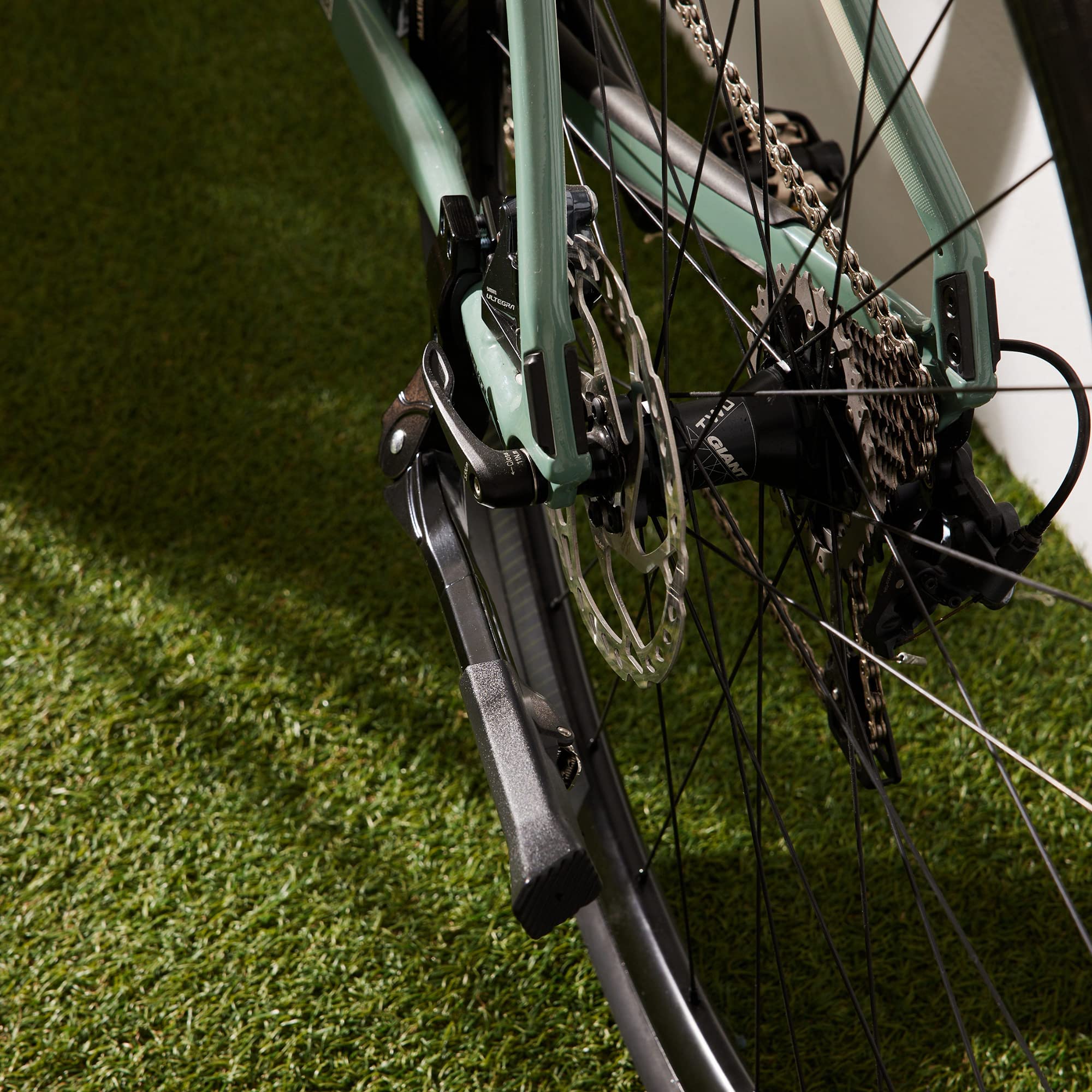 N+1 lifestyle shot of bike parked in park showing dependable support