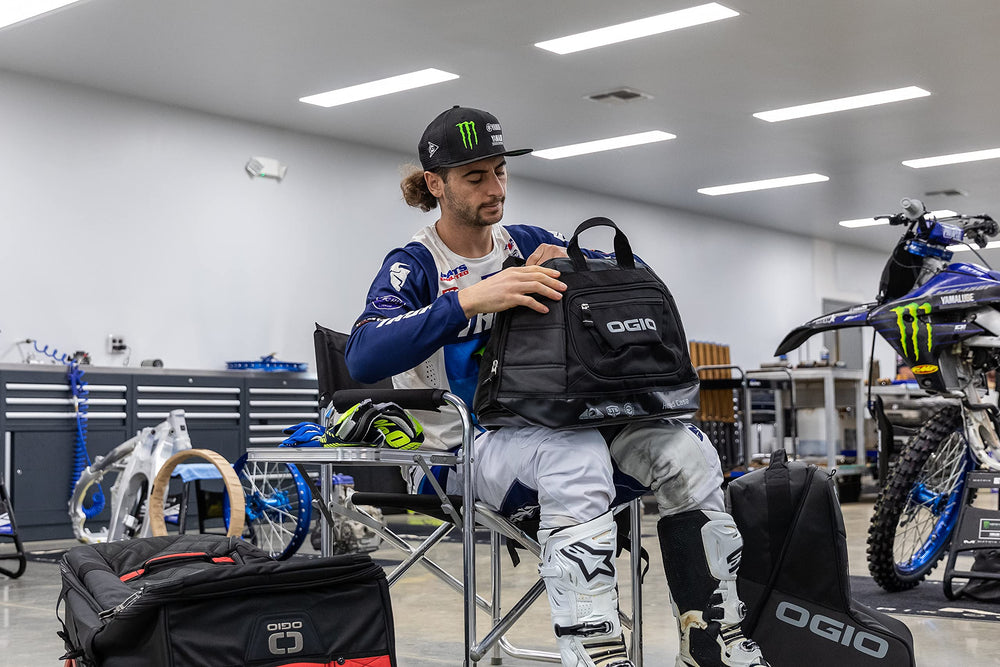 OGIO bag attached to motorcycle or in trunk, simplifies safe helmet transport