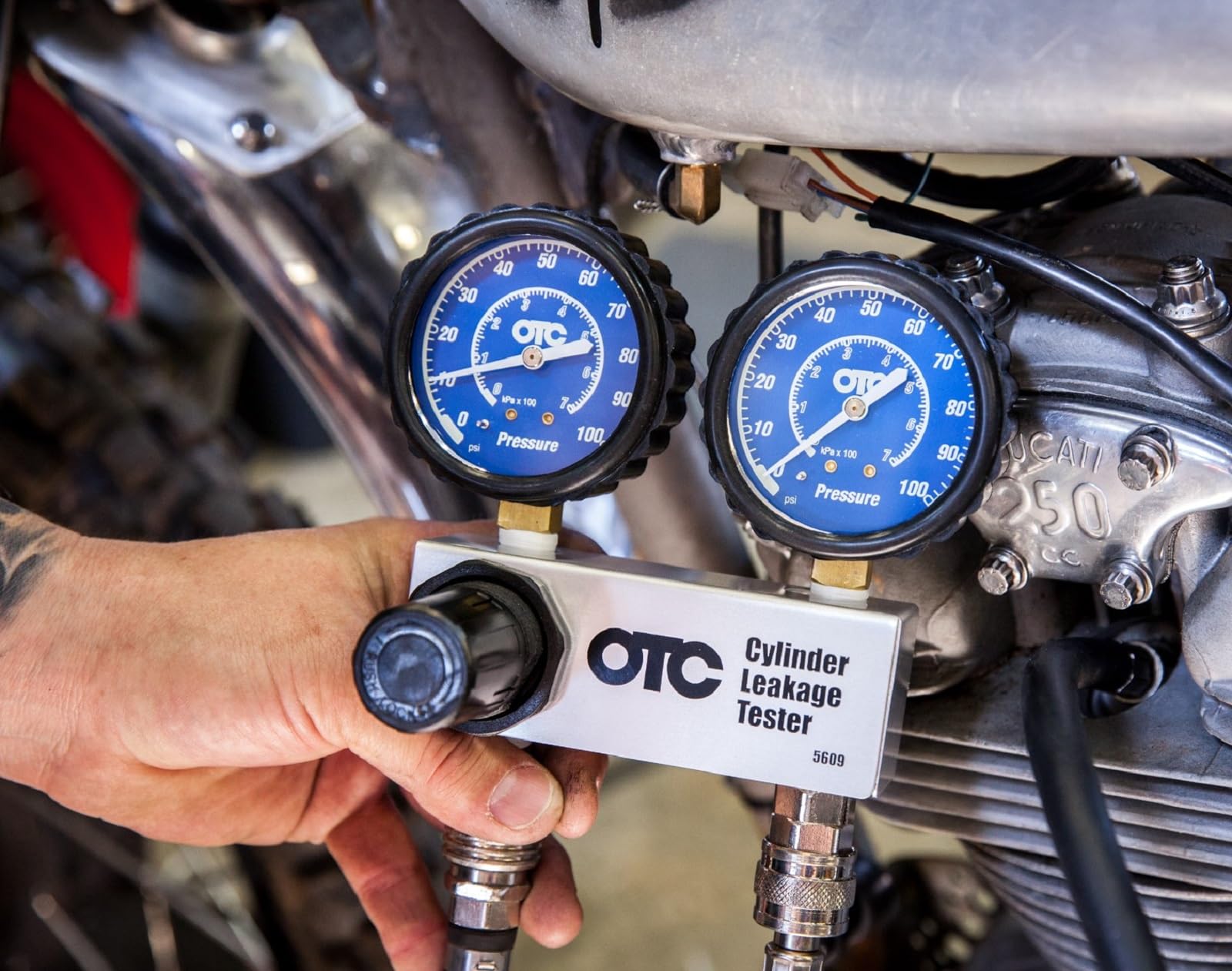 OTC 5609 aluminum manifold and regulator showing durable shop-grade control
